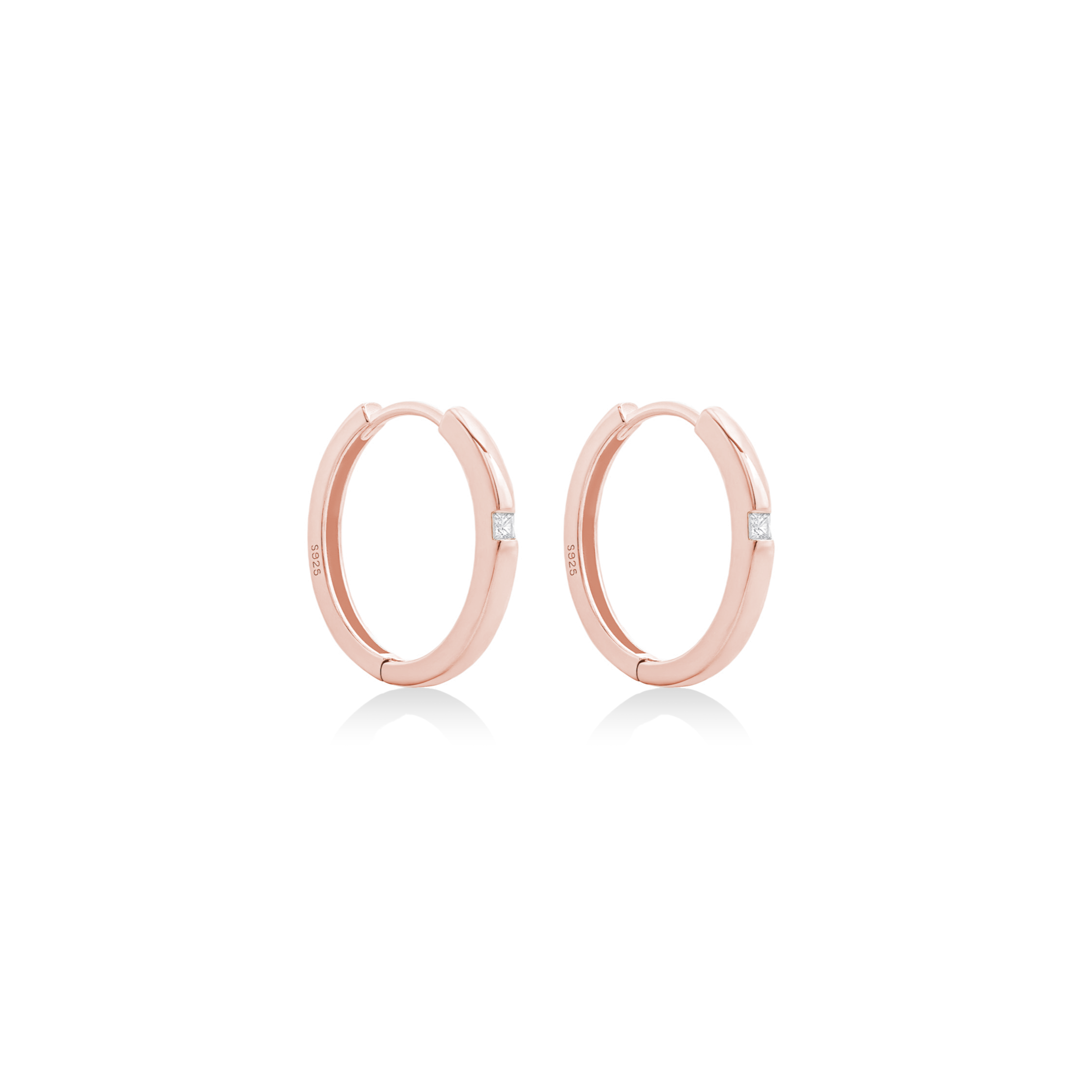 Fine jewellery, silver jewellery plated with rose gold, hypoallergenic, tarnish-free, close-up right view of Rose gold hoop earrings on a white background