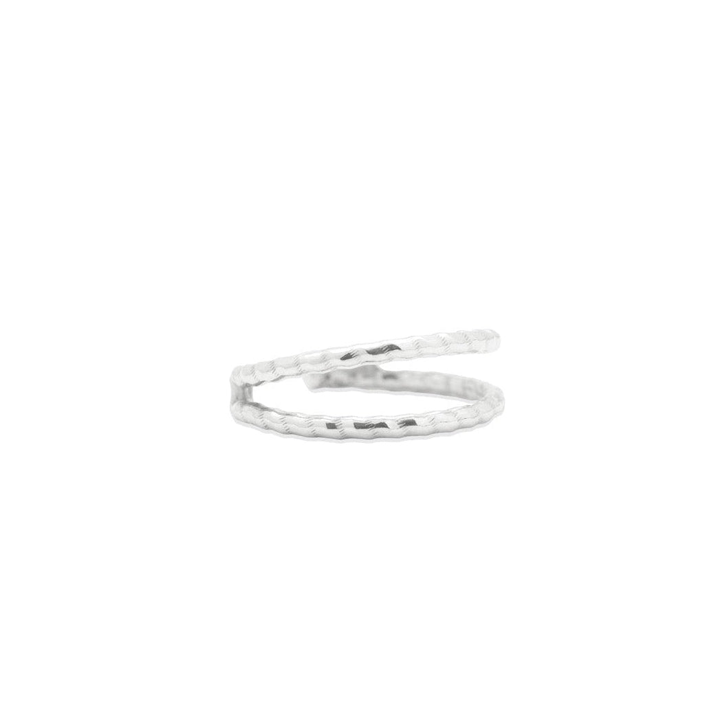 Silver ring on a white background, close up side view