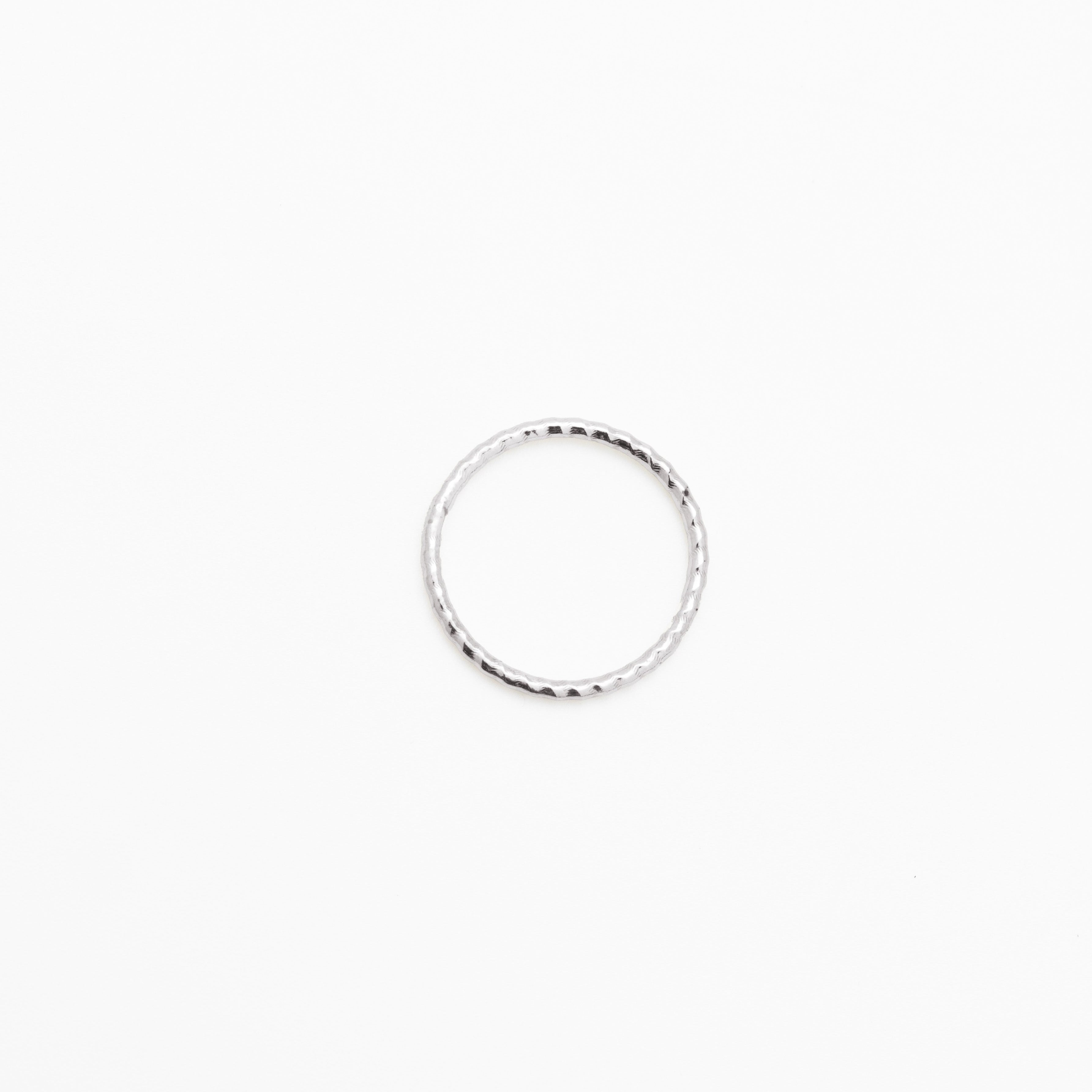 Silver ring on a white background, close up top view