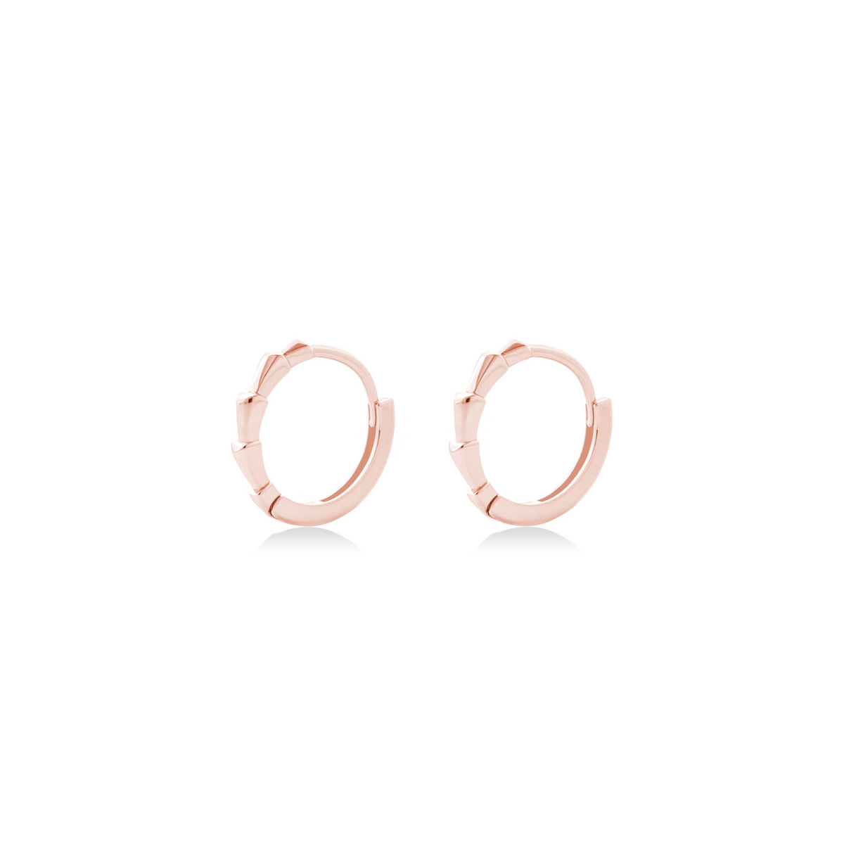 Fine jewellery, silver jewellery plated with rose gold, hypoallergenic, tarnish-free, close up left view of a pair of Rose gold hoop earrings on a white background