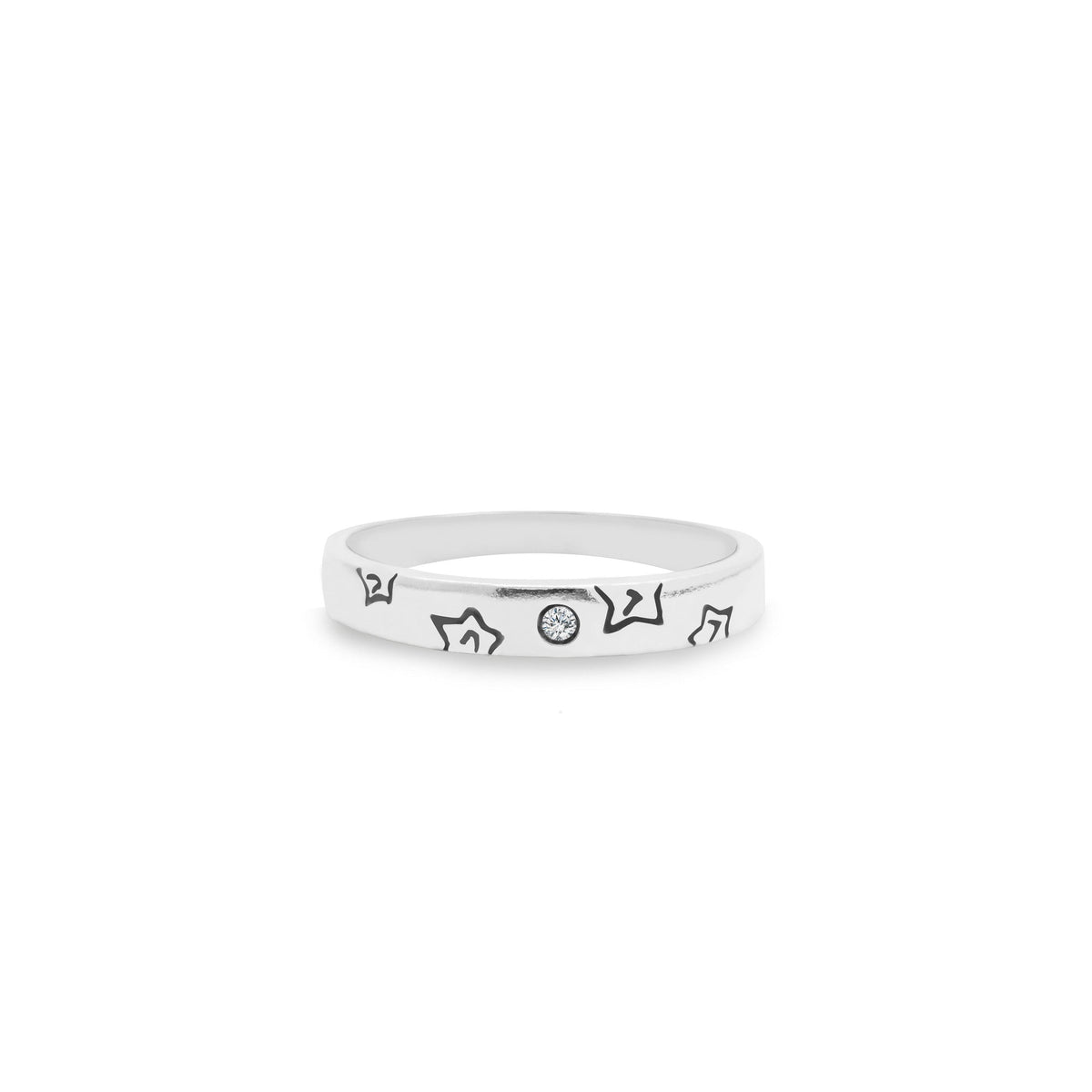 Silver ring with engraved designs on a white background, close up front view